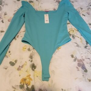Green bodysuit.